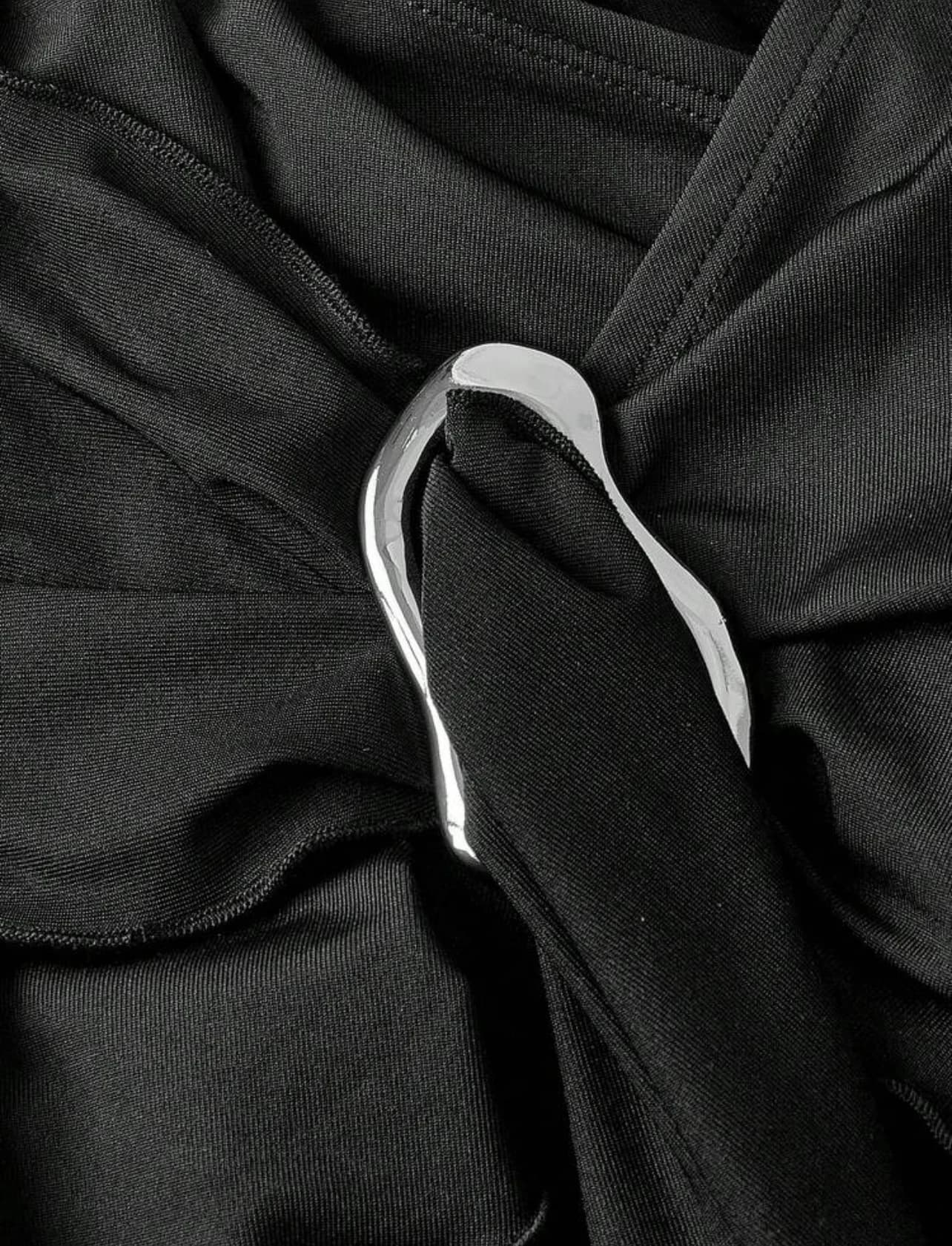 Black Asymmetric Halter Buckle Top — buckle detail view